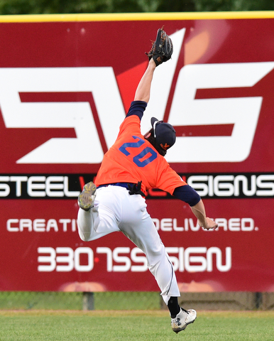STRUTHERS, OHIO - JULY 31, 2015: Right fielder Kyle Benyo #20 of Youngstown Cene leaps to make a over the shoulder catch for the out in the 2nd inning during Friday nights PONY tournament game at Cene Park. DAVID DERMER | THE VINDICATOR