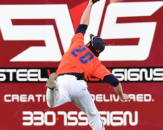 STRUTHERS, OHIO - JULY 31, 2015: Right fielder Kyle Benyo #20 of Youngstown Cene leaps to make a over the shoulder catch for the out in the 2nd inning during Friday nights PONY tournament game at Cene Park. DAVID DERMER | THE VINDICATOR