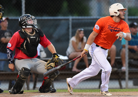 STRUTHERS, OHIO - JULY 31, 2015: Greg Popatak #17 of Youngstown Cene leaves the batters box after hitting a triple  in the 3rd inning during Friday nights PONY tournament game at Cene Park. DAVID DERMER | THE VINDICATOR...Catcher Mason Prickett #74 pictured.