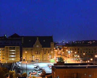 The peaceful glow is disrupted when the doors at the Youngstown Fire Department open and firetrucks emerge with sirens ringing into the still night. Seen here is Front Street.
