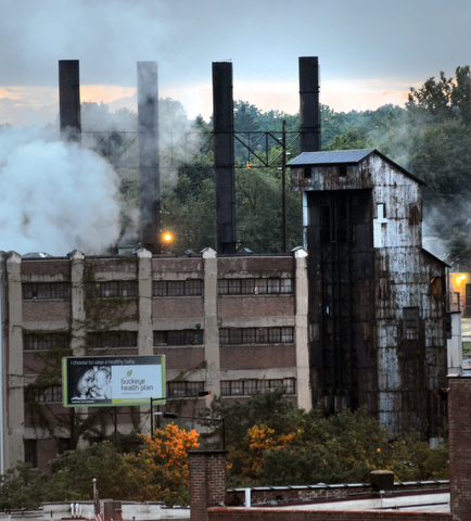 Smoke rising from an old factory distinguishes the landscape and is reminiscent of the steel industry that Youngstown is known for.