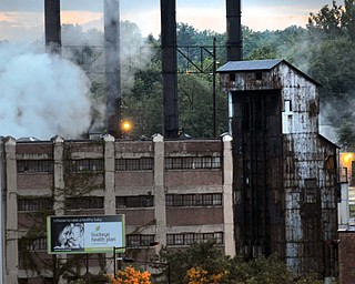Smoke rising from an old factory distinguishes the landscape and is reminiscent of the steel industry that Youngstown is known for.