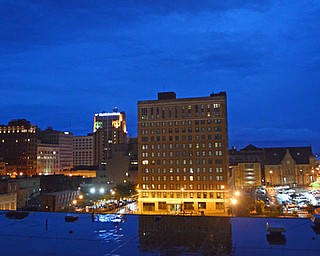 The peaceful glow is disrupted when the doors at the Youngstown Fire Department open and firetrucks emerge with sirens ringing into the still night.