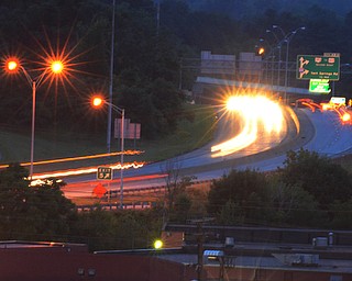 Traffic flows on 680 at night the Youngstown landscape can be seen by drivers on the interstate.