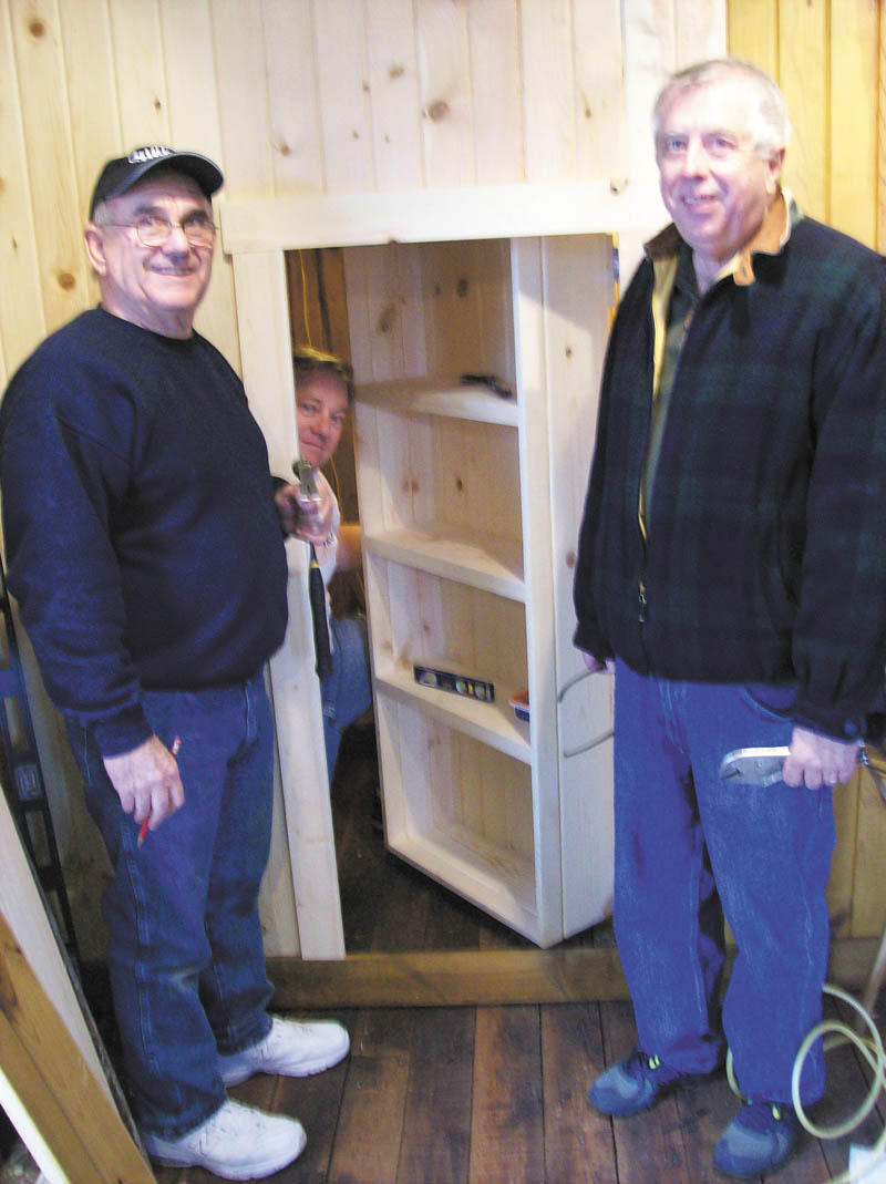 SPECIAL TO THE VINDICATOR
Salem Historical Society’s Freedom Hall now has a secret hiding place, replicating those used in Salem to help fugitive slaves on their journey to freedom in Canada. The addition was the idea of Jerry Laska, education coordinator, and Lou Ranieri and Mike Wargo, society volunteers, built it. Third-graders of Reilly School were the first to view the secret room, enhancing their understanding of how escaping slaves were helped by Salem abolitionists. The museum is open for tours from 1 to 4 p.m. Sundays. For information call 330-337-8514. Above, Ranieri and Laska stand outside while Wargo demonstrates the hiding room.