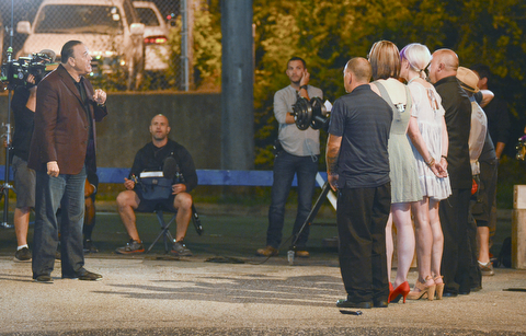 Jon Taffer, bar and nightlife management expert and star of SpikeTVÕsÒBar RescueÓ, speaks to the owners and bartenders of the Royal Oaks bar, 924 Oak St., when filming scenes for the unveiling of the barÕs makeover.