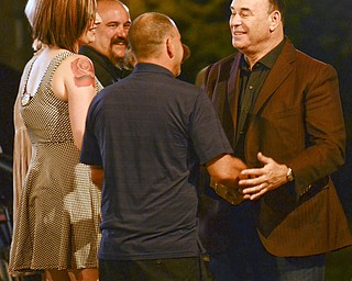 Jon Taffer, bar and nightlife management expert and star of SpikeTVÕsÒBar RescueÓ, speaks to the owners and bartenders of the Royal Oaks bar, 924 Oak St., when filming scenes for the unveiling of the barÕs makeover.