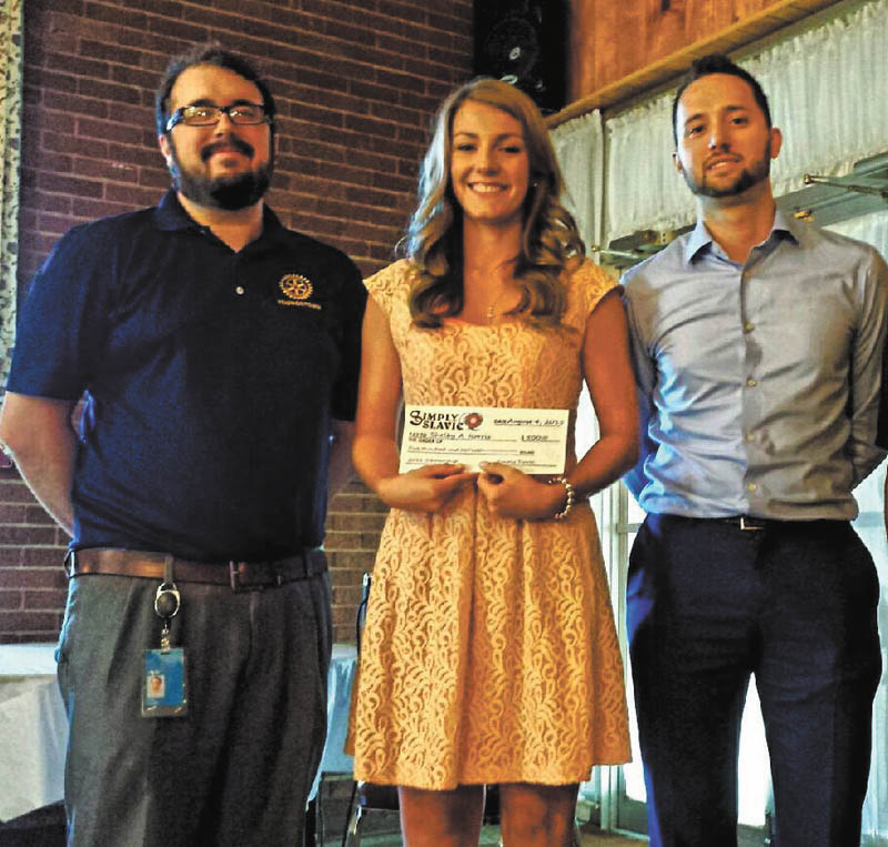 SPECIAL TO THE VINDICATOR
The Simply Slavic Committee announces that Youngstown State University student Shelby Norris, center, has won its 2015 $500 scholarship. A college sophomore from Lowellville, Norris will use the money to assist with her tuition as she pursues a degree in hospitality management. She had submitted a 500-word essay on how being Slavic affects her life. At left is John Slanina, chairman of Simply Slavic community relations, and at right is Dave Slanina, treasurer of Simply Slavic. Funding for the scholarship is generated from the annual June Simply Slavic festival in Youngstown.