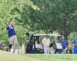 Jeff Lange | The Vindicator  AUGUST 17, 2015 - Rob Davies of Champion (left) watches his shot down the 8th fairway as his teammates Don Fleck, Russ Shuttleworth and Brian Haynam look on from behind during Monday afternoon's Greatest Golfer of the Valley scramble held at the Lake Club in Poland.