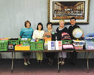 SPECIAL TO THE VINDICATOR
Our Lady of Mount Carmel Basilica, St. Monica Guild has donated more than $500 of school supplies to St. Joseph the Provider School in Youngstown. The school serves inner-city children of all faiths. From left are Cheryl Jablonski, school principal; Rosemarie Bisignani and Angela DeFrangia, guild members; Beverly Pondillo, guild president; and the Rev. Michael Swierz, school president. Guild members Joan Pondillo and Carmela Guy are not pictured.