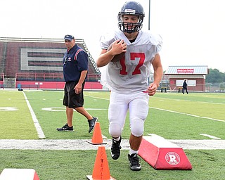 AUSTINTOWN, OHIO - AUGUST 11, 2015: Junning back Joe Zupko #17 of Fitch runs with the football during a drill Tuesday morning during a preseason practice at Fitch High School. DAVID DERMER | THE VINDICATOR