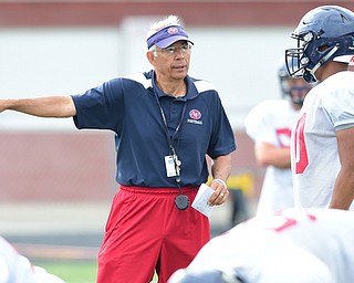 AUSTINTOWN, OHIO - AUGUST 11, 2015: Head coach Phil Annarella gives instructions to Lawrence Harrington #10 before the snap Tuesday morning during a preseason practice at Fitch High School. DAVID DERMER | THE VINDICATOR