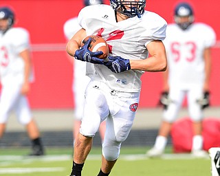 AUSTINTOWN, OHIO - AUGUST 11, 2015: Joey Zielinski #12 of Fitch runs with the football after a reception during a preseason practice at Fitch High School. DAVID DERMER | THE VINDICATOR