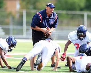 AUSTINTOWN, OHIO - AUGUST 11, 2015: Coach Steve Zielinski of Fitch instructs the kids to do a up down during a defensive pursuit drill during a preseason practice at Fitch High School. DAVID DERMER | THE VINDICATOR