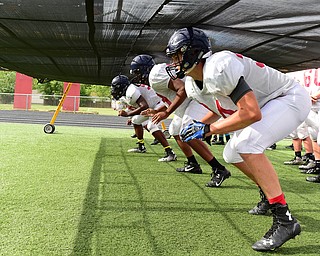 AUSTINTOWN, OHIO - AUGUST 11, 2015: Bryce Warmouth #34 of Fitch runs through the chute during a defensive line drill during a preseason practice Tuesday morning during a preseason practice at Fitch High School. DAVID DERMER | THE VINDICATOR
