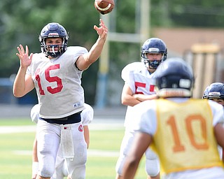 AUSTINTOWN, OHIO - AUGUST 11, 2015: Quarterback Kyle Kent #15 of Fitch throws a pass to Lawrence Harrington #10 during a 7 on 7 session session Tuesday morning during a preseason practice at Fitch High School. DAVID DERMER | THE VINDICATOR