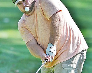 Jeff Lange | The Vindicator  AUGUST 21, 2015 - John Doughton III of Hubbard chips onto the green of hole 16 during the Greatest Golfer of the Valley tournament at Mill Creek Golf Course in Canfield, Friday, August 21st.