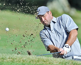 Jeff Lange | The Vindicator  AUGUST 21, 2015 - Derek Knepper of Canfield looks through a wall of sand as he hits out of the bunker on hole 17 during Friday's Greatest Golfer of the Valley tournament at Mill Creek Golf Course.