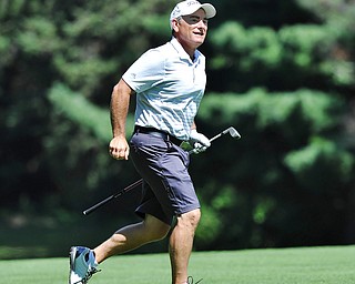 Jeff Lange | The Vindicator  AUGUST 22, 2015 - Ed Nappi of Columbiana runs onto the fairway to get a better look at his shot from the rough on No. 4 during Saturday's Greatest Golfer of the Valley tournament held at .Youngstown Country Club.