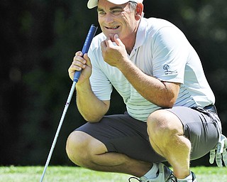 Jeff Lange | The Vindicator  AUGUST 22, 2015 - Ed Nappi of Columbiana scratches his chin as he reads the green at hole No. 5 during Saturday afternoon's Greatest Golfer of the Valley tournament held at Youngstown Country Club.