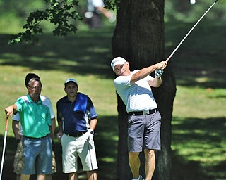 Jeff Lange | The Vindicator AUGUST 22, 2015 - Ed Nappi of Columbiana watches his shot from the tee as Wendell Wagnon and Matt DiLoreto look on from behind during Saturday's Greatest Golfer of the Valley tournament held at Youngstown Country Club.