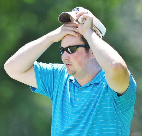 Jeff Lange | The Vindicator  AUGUST 22, 2015 - Steven Smoot of Brookfield wipes the sweat from his forehead during Saturday's Greatest Golfer of the Valley tournament held at Youngstown Country Club.