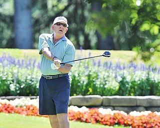 Jeff Lange | The Vindicator  AUGUST 22, 2015 - John Scarsella of Youngstown watches his tee shot from the No. 3 tee during Saturday's Greatest Golfer of the Valley tournament held at Youngstown Country Club.