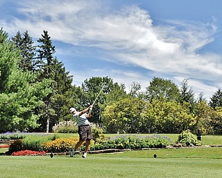Jeff Lange | The Vindicator AUGUST 22, 2015 - Paul Keller of Canfield smacks his ball off the No. 8 tee during Saturday's Greatest Golfer of the Valley tournament held at Youngstown Country Club.