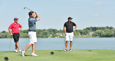 Jeff Lange | The Vindicator  AUGUST 23, 2015 - Jonah Karzmer of Poland (center), Michael Porter (left) and Scott Porter look on at Karzmer's tee shot late in the Greatest Golfer tournament held at the Lake Club in Poland, Sunday afternoon.