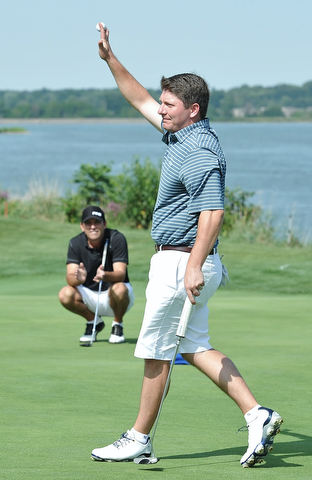 Jeff Lange | The Vindicator  AUGUST 23, 2015 - Jonah Karzmer of Poland waves his ball above his head in celebration of winning the Pete Mollica's Open Division Greatest Golfer championship, Sunday afternoon at the Lake Club in Poland. Karzmer won by 5 strokes with a final score of 213.