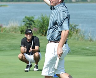 Jeff Lange | The Vindicator AUGUST 23, 2015 - Jonah Karzmer of Poland waves his ball above his head in celebration of winning the Pete Mollica's Open Division Greatest Golfer championship, Sunday afternoon at the Lake Club in Poland. Karzmer won by 5 strokes with a final score of 213.