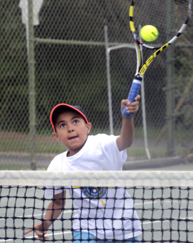 Katie Rickman | The Vindicator. Loui Mussa 10 from Beit Safafa hits a tennis ball during the Israeli Tennis Center exhibition at Youngstown Country Club August 24, 2015.