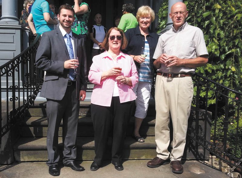 SPECIAL TO THE VINDICATOR
From left, Anthony Seminaro and Linda Bishop, Trumbull Memorial Hospital associates, and Martha Flint and Ken Conklin, Upton House trustees, celebrate the addition of a 1920s railing to the steps of the Upton House, 380 Mahoning Ave., Warren. TMH donated the railing that was torn down by renovation at the hospital.