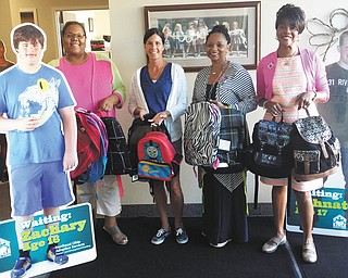 SPECIAL TO THE VINDICATOR
Alpha Kappa Alpha Sorority, Inc.-Epsilon Mu Omega Chapter in Youngstown recently provided more than 85 backpacks to local children in foster care through Northeast Ohio Adoption Services. The sorority collected the backpacks through its Launching New Dimensions of Service program. The goal was to collect 66 backpacks, which represents the number of years the chapter has been chartered. Above, from left, are Deanna Brown, vice president of the sorority chapter for seven years; Kathy Evans, director of marketing and recruitment at NOAS; Dr. Tonia L. Farmer, protocol chairman of the sorority chapter for 14 years; and Annie Constant, president of the sorority chapter for 13 years.