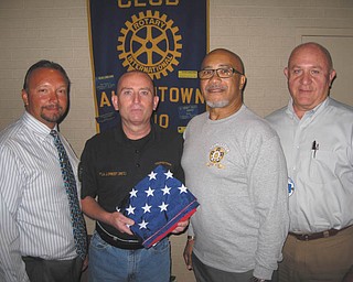 SPECIAL TO THE VINDICATOR
Above are Mark Cole, Austintown Rotary flag chairman; John Prest and Rick Alli from Youngstown Fraternal Order of Police; and Mal Culp president of the club. Prest and Alli talked about the Police Officers Memorial at the end of the South Avenue bridge at the Aug. 24 meeting of Austintown Rotary. Police officer Michael Hartzell, a Fitch graduate, who died in the line of duty, is the most recent name added. The Rotary donated one of the flags from the Rotary flag lease program to the FOP since the wind wears the flags out quickly. Below are Culp and Bob Wirtz, representative of Gateways to Better Living, who shared that the agency has 16 group homes in the Mahoning County with seven of those in Austintown. Gateways is a nonprofit organization which provides the least restrictive and appropriate environment for the developmentally disabled.