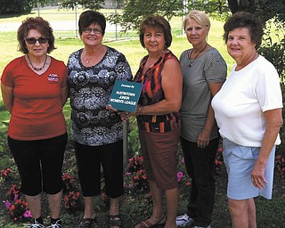 SPECIAL TO THE VINDICATOR
Members of GFWC Ohio Austintown Junior Women’s League recently met at the 911 Memorial Park on Raccoon Road to dedicate a plaque in recognition of the league’s volunteer efforts. AJWL members weed and beautify a designated area of the park and maintain an arched arbor and seating area. Preparing to place the plaque above, from left, are Ellen Kosa, president; Kathy Rusback; Sue Hovanec, committee chairman; Mary Toporcer and Jan Zoccali.
