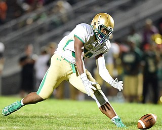 YOUNGSTOWN, OHIO - AUGUST 28, 2015: Linebacker Jabbar Price #52 of Ursuline dives on a loose ball after a East fumble during the 2nd half of a game Friday night at Rayen Stadium. DAVID DERMER | THE VINDICATOR