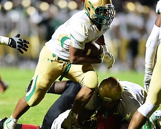 YOUNGSTOWN, OHIO - AUGUST 28, 2015: Running back Deinn Edwards #8 of Ursuline sprints into the end zone to score a touchdown during the 2nd half of a game Friday night at Rayen Stadium. DAVID DERMER | THE VINDICATOR
