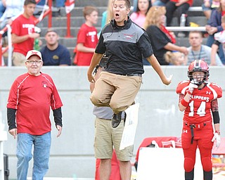 Jeff Lange | The Vindicator  AUGUST 27, 2014 - Columbiana head coach Bob Spaite jumps as he reacts to a play on the field during second quarter action against Western Reserve on Thursday night at Firestone Stadium in Columbiana.