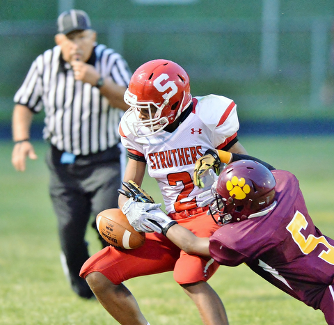 Jeff Lange | The Vindicator  AUGUST 28, 2015 - Struthers' Takale Rushton (2) has the pass knocked away by Liberty's Dra Rushton in the second quarter of their game, Friday night in Liberty.