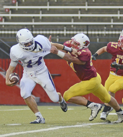 Katie Rickman | The Vindicator..Despite a rough start, Mooney fought hard to keep up as Mooney's Vinny Gentile #54 tackled St. Joseph's Bryan Costabile #14 during the first half of the game at Youngstown State University's Stambaugh Stadium August 28, 2015.