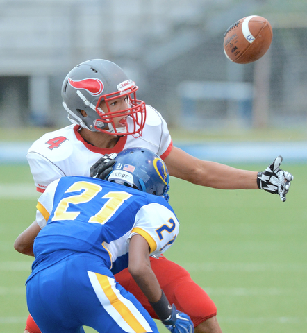 Jeff Lange | The Vindicator  AUGUST 29, 2015 - Labrae's Keevon Harris (4) eyes the fumbled ball as he is tackled by Valley Christian's Jordan Trowers (21) in the first quarter of their game, Saturday night in Poland.