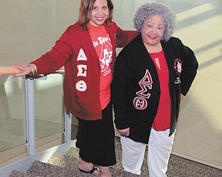 KATIE RICKMAN  | THE VINDICATOR

Susan Moorer, left, incoming president of Youngstown Alumnae Chapter of Delta Sigma Theta Sorority Inc., and Nikki Davis, a committee member of the Tribute to Black Excellence, show their affiliation to the public service sorority. They’re promoting the tribute set Sept. 25 at Mahoning Country Club.
