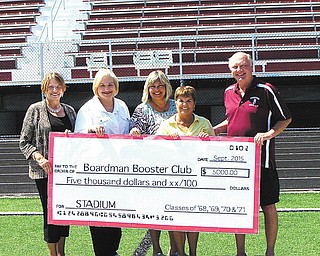 SPECIAL TO THE VINDICATOR
A fundraiser by Boardman High School classes of 1968, 1969, 1970 and 1971 to benefit the new Boardman stadium recently raised $6,200. Having reached and surpassed $5,000 in fundraising, the classes will become members of the Touchdown Club. A check was recently presented at the new stadium by class representatives Edie Davidson ’68, left, Linda Evans ’69, Jan Garver ’71, and coordinator Debbie Chick ’70, to Booster president Bill Bonte.