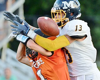 Jeff Lange | The Vindicator  SEPTEMBER 4, 2015 - McDonald's Dylan Portolese (13) breaks up a pass intended for Tigers' Cody Allen (bottom) in the end zone during second quarter action of their game, Friday night in Springfield.