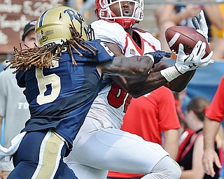 Jeff Lange | The Vindicator  SEPTEMBER 5, 2015 - YSU wide receiver Andrew Williams (right) catches a deep pass against Pitt defender Lafayette Pitts (6) during second half action of their game, Saturday afternoon at Heinz Field.