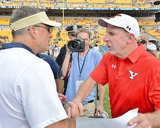 Jeff Lange | The Vindicator  SEPTEMBER 5, 2015 - YSU head coach Bo Pelini (right) shakes hands with Pitt's Pat Narduzzi after their game, Saturday afternoon at Heinz Field.