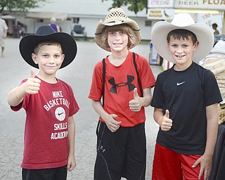 Katie Rickman | The Vindicator.from left.Cole Mulichak 7 and his brothers Connor 12, and Ethan 9 give the thumbs up after trying on cowboy hats at the 169th Canfield Fair on Sept 3, 2015.