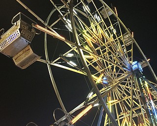 Katie Rickman | The Vindicator.At night the temperatures drop to a comfortable degree and many enjoy rides until the park closes during the 169th Canfield Fair on Sept 3, 2015.