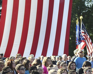 Katie Rickman | The Vindicator.Students from Austintown Fitch Middle School fill bleachers as they listen to speakers during the Mahoning Valley 9-11 Memorial Ceremony at the 9-11 Memorial Park on Raccoon Road on September 11, 2015.